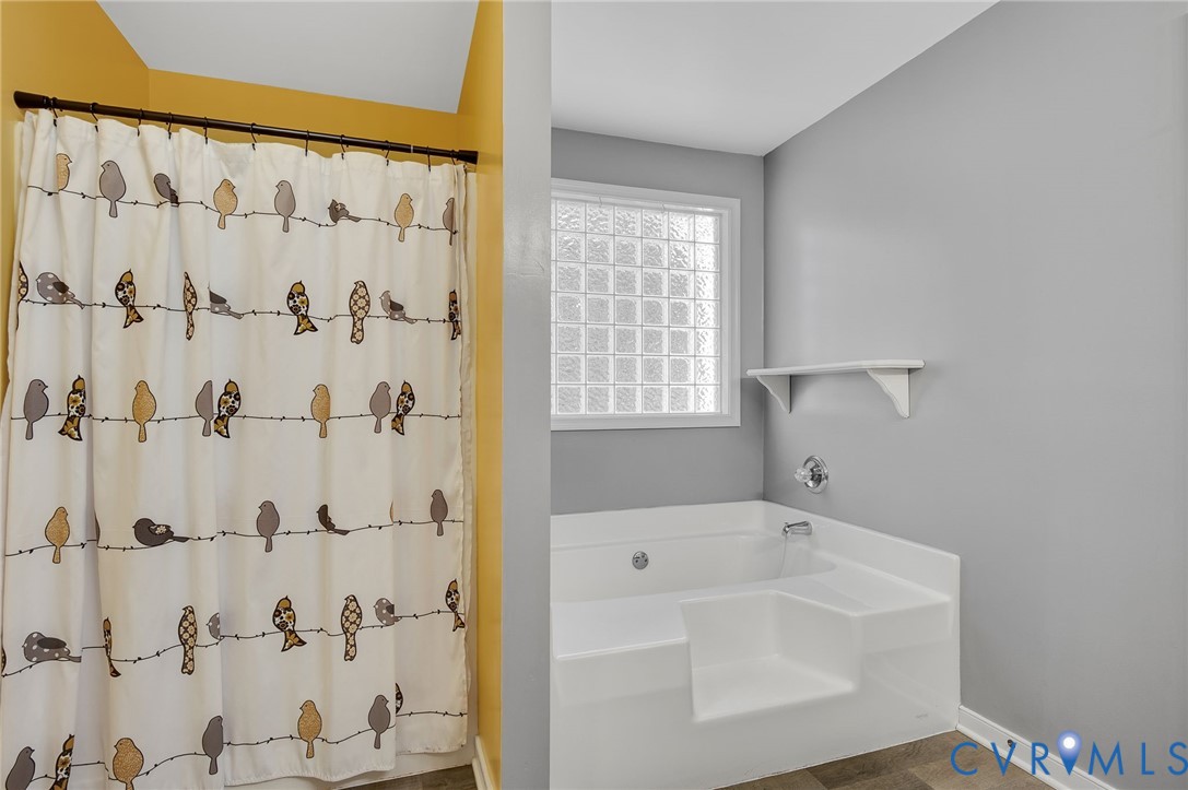 1918 Castle Glen Drive Chesterfield, VA 23236 - Photo 28 of 33 a bathroom with a bathtub and shower