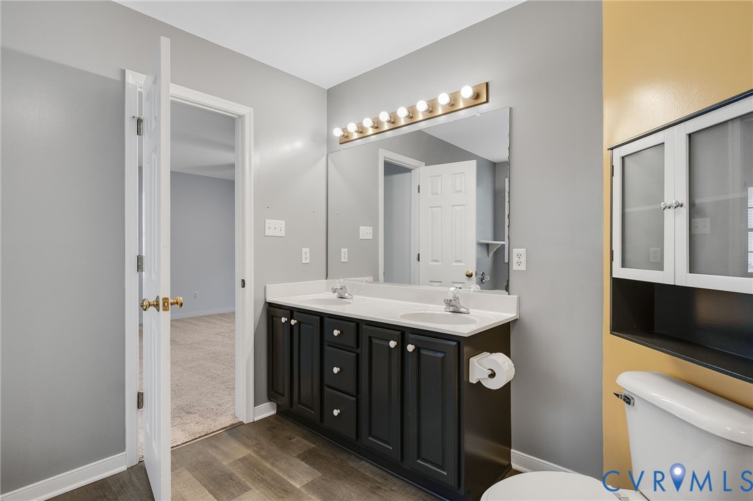 1918 Castle Glen Drive Chesterfield, VA 23236 - Photo 29 of 33 a bathroom with a double vanity sink and a mirror