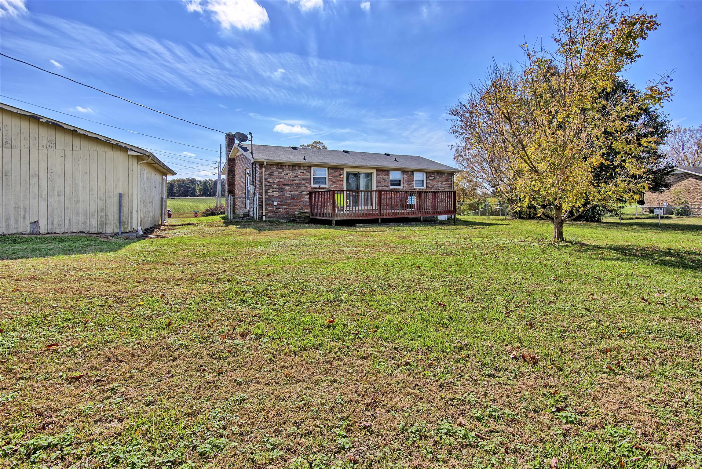 7487 Deer Ridge Road Primm Springs, TN 38476 - Photo 3 of 13 a view of a house with a big yard