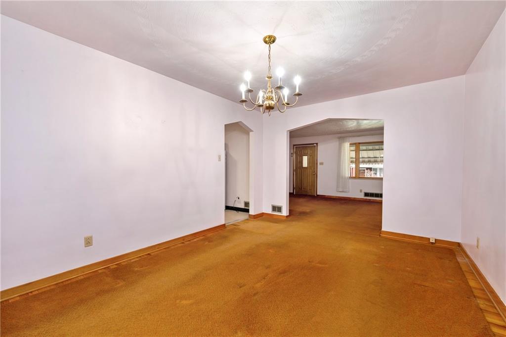 663 Loretta Street Pittsburgh, PA 15217 - Photo 14 of 17 a view of a big room with windows and chandelier