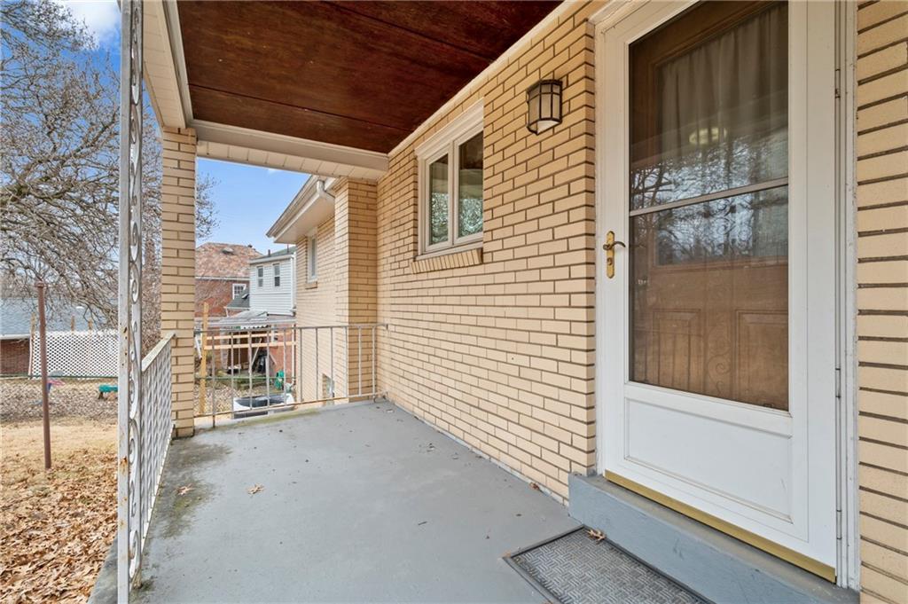 663 Loretta Street Pittsburgh, PA 15217 - Photo 3 of 17 a view of a porch with a door and a door