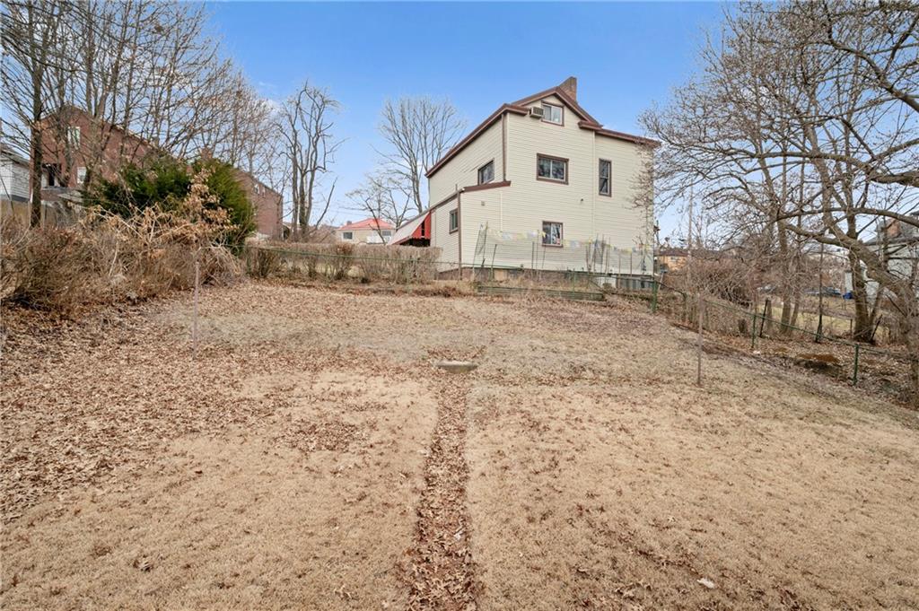 663 Loretta Street Pittsburgh, PA 15217 - Photo 4 of 17 a view of a white house with a yard