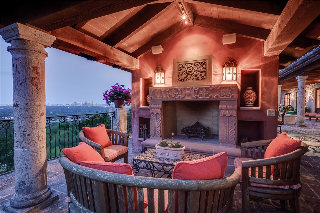 a outdoor space with patio fireplace and furniture