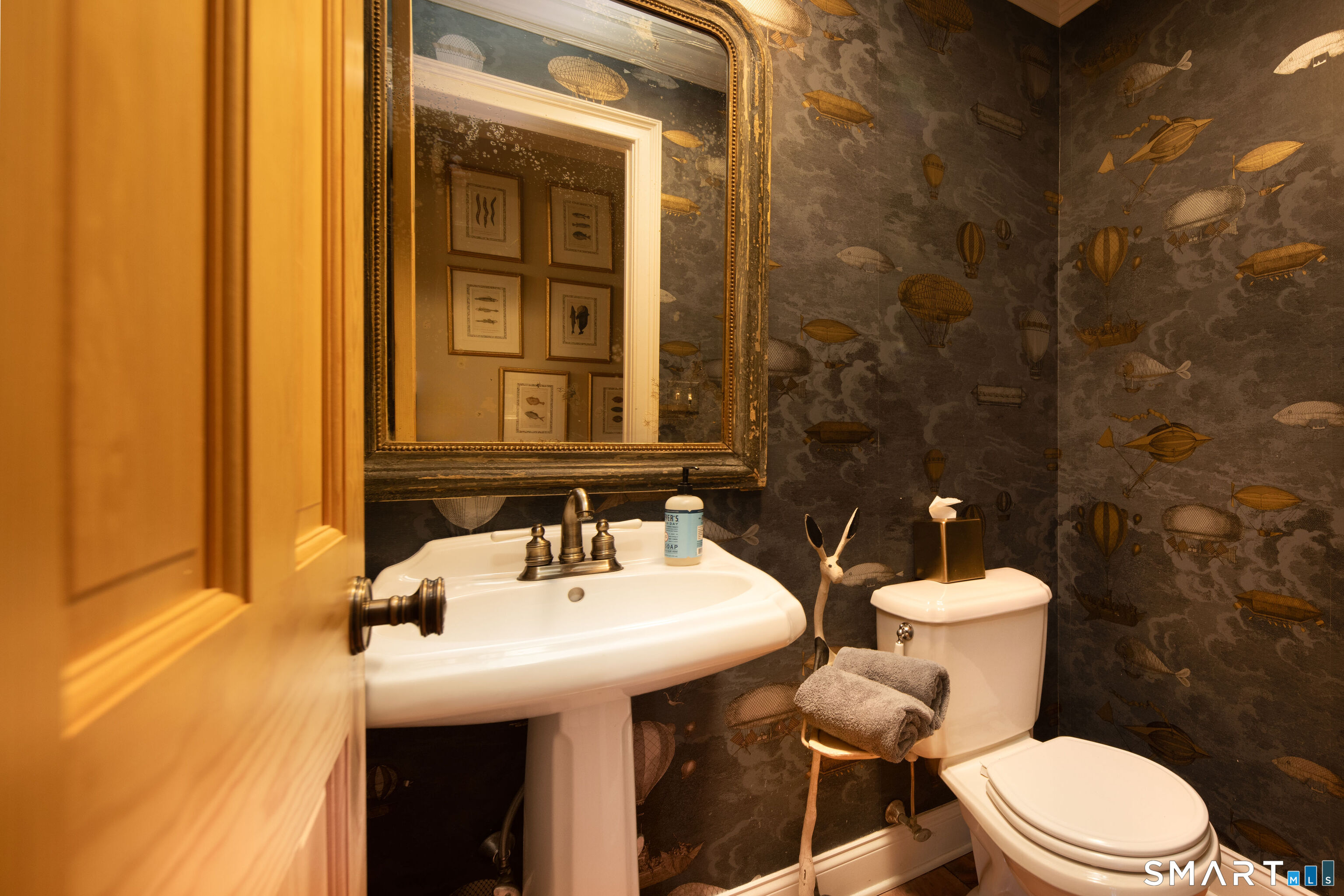 7 Cooper Hill Road Salisbury, CT 06068 - Photo 22 of 36 a bathroom with a sink mirror and toilet
