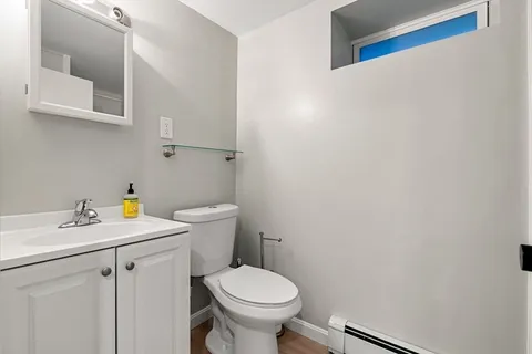 a view of bathroom with a sink and a toilet