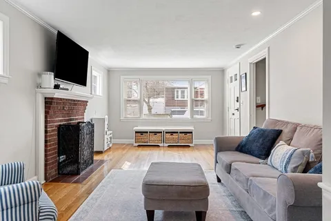 a living room with furniture fireplace and flat screen tv
