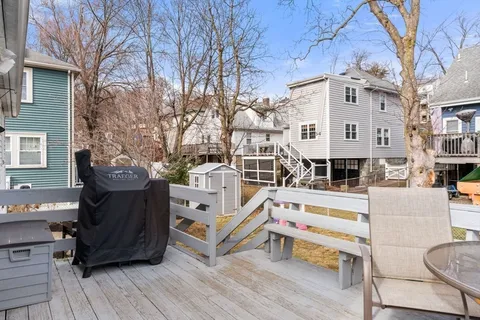 a view of a house with pool and chairs