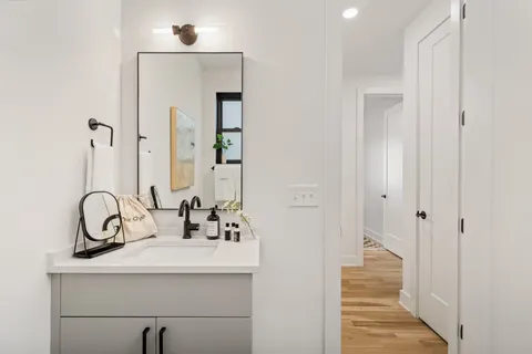 a bathroom with a sink and a mirror
