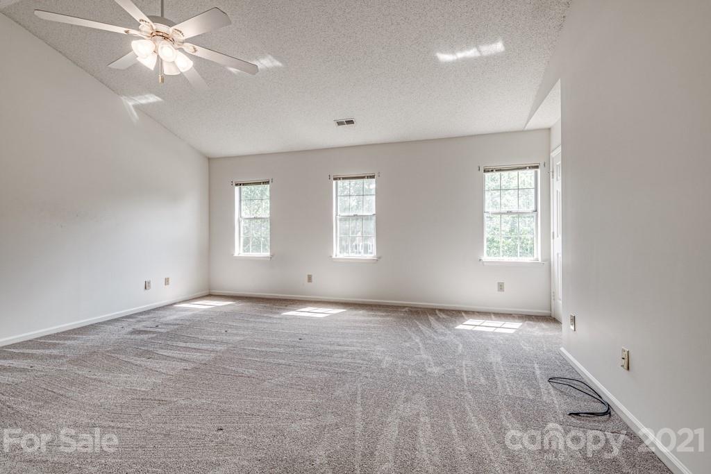 4516 Brownes Ferry Road Charlotte, NC 28269 - Photo 16 of 32 a view of an empty room with a window