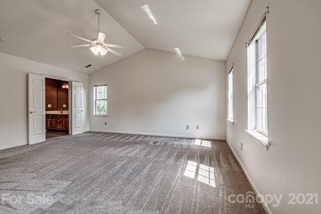 4516 Brownes Ferry Road Charlotte, NC 28269 - Photo 17 of 32 wooden floor in an empty room with a window