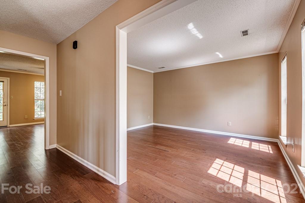 4516 Brownes Ferry Road Charlotte, NC 28269 - Photo 3 of 32 a view of hallway with wooden floor