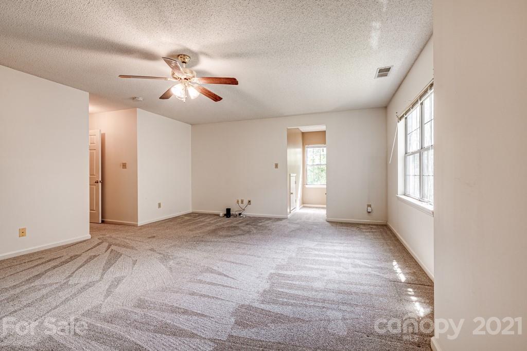 4516 Brownes Ferry Road Charlotte, NC 28269 - Photo 23 of 32 a view of an empty room with a window