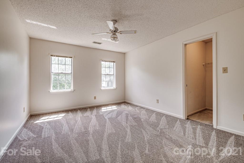 4516 Brownes Ferry Road Charlotte, NC 28269 - Photo 24 of 32 a view of an empty room with a window