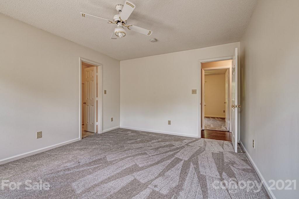 4516 Brownes Ferry Road Charlotte, NC 28269 - Photo 25 of 32 a view of empty room with a ceiling fan
