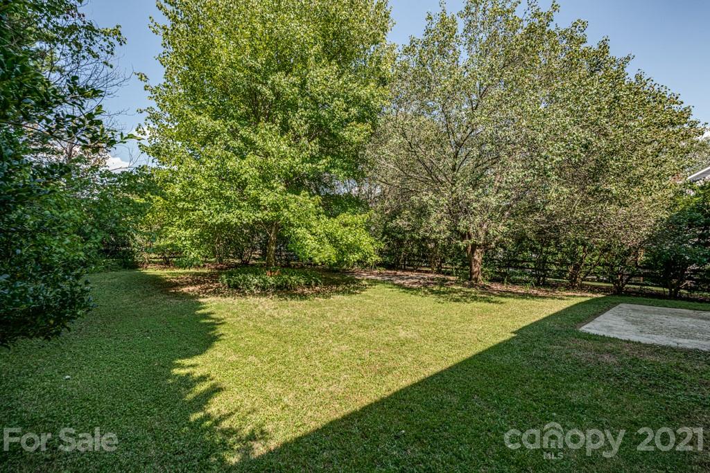 4516 Brownes Ferry Road Charlotte, NC 28269 - Photo 29 of 32 a view of a swimming pool with an outdoor space and seating area
