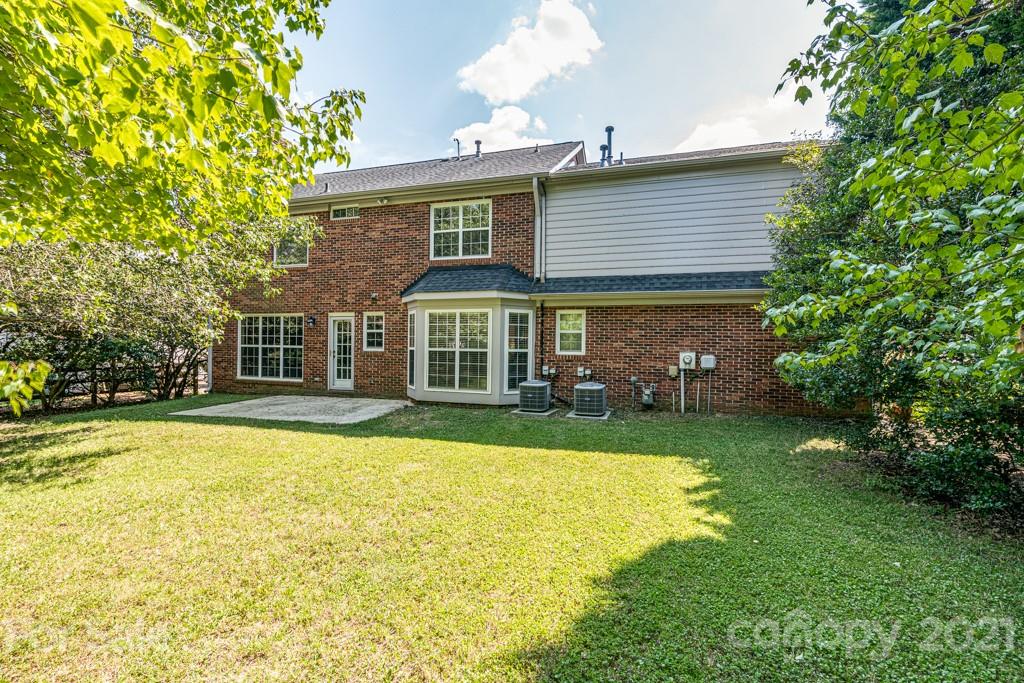 4516 Brownes Ferry Road Charlotte, NC 28269 - Photo 31 of 32 a front view of a house with a yard