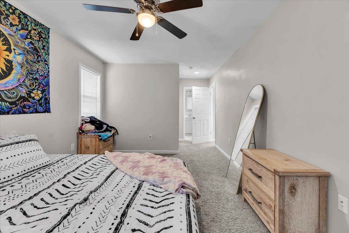 1624 24th Street Northeast Roanoke, VA 24012 - Photo 20 of 25 a bedroom with a bed and a chandelier