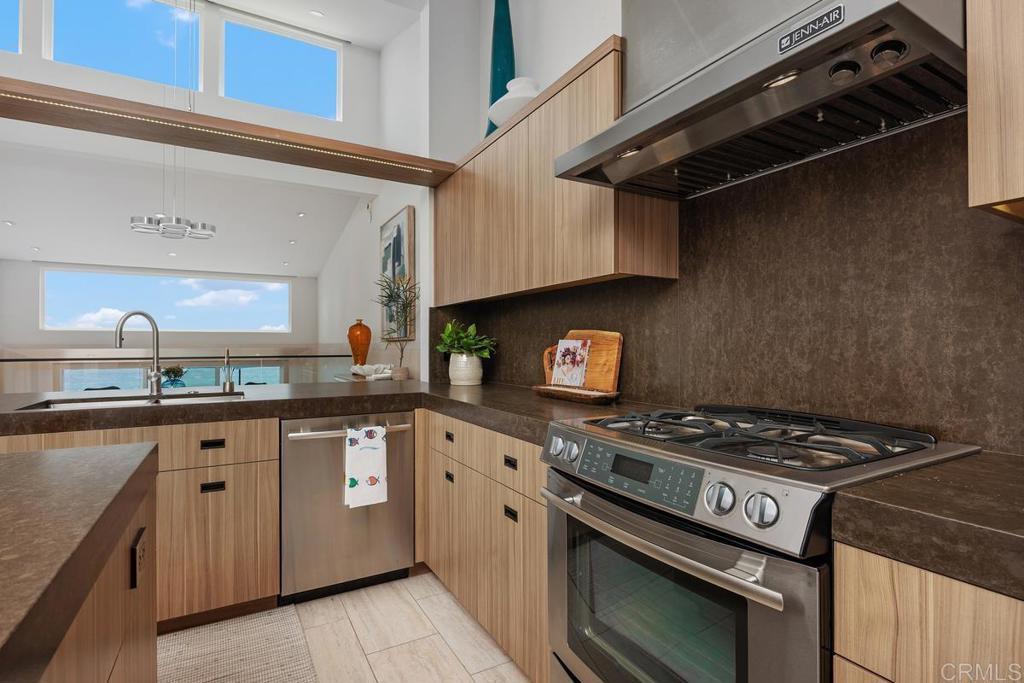 1856 Parliament Road Encinitas, CA 92024 - Photo 13 of 42 a kitchen with cabinets and appliances