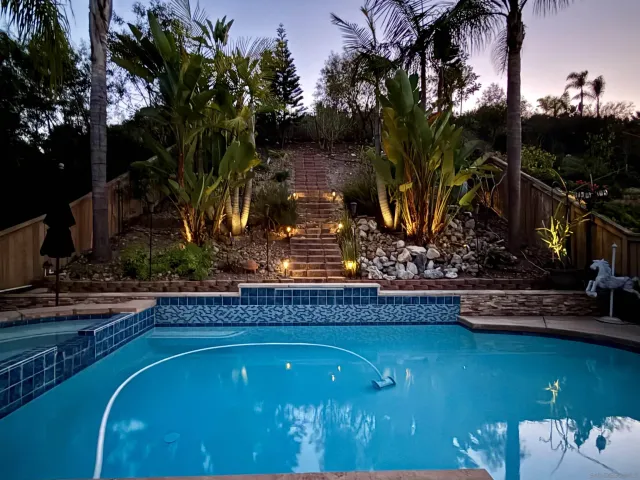 a view of a swimming pool with a patio
