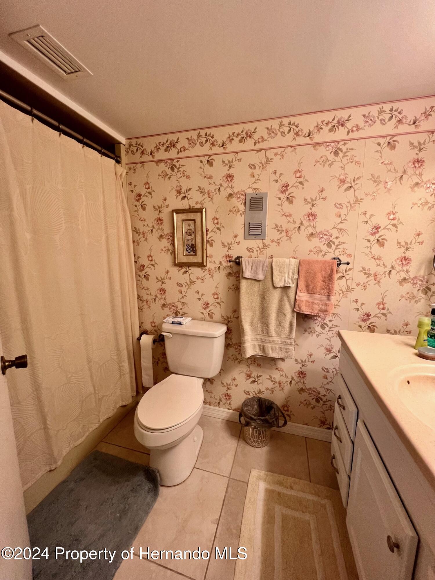 4660 Marine Parkway New Port Richey, FL 34652 - Photo 14 of 18 a bathroom with a toilet and a sink