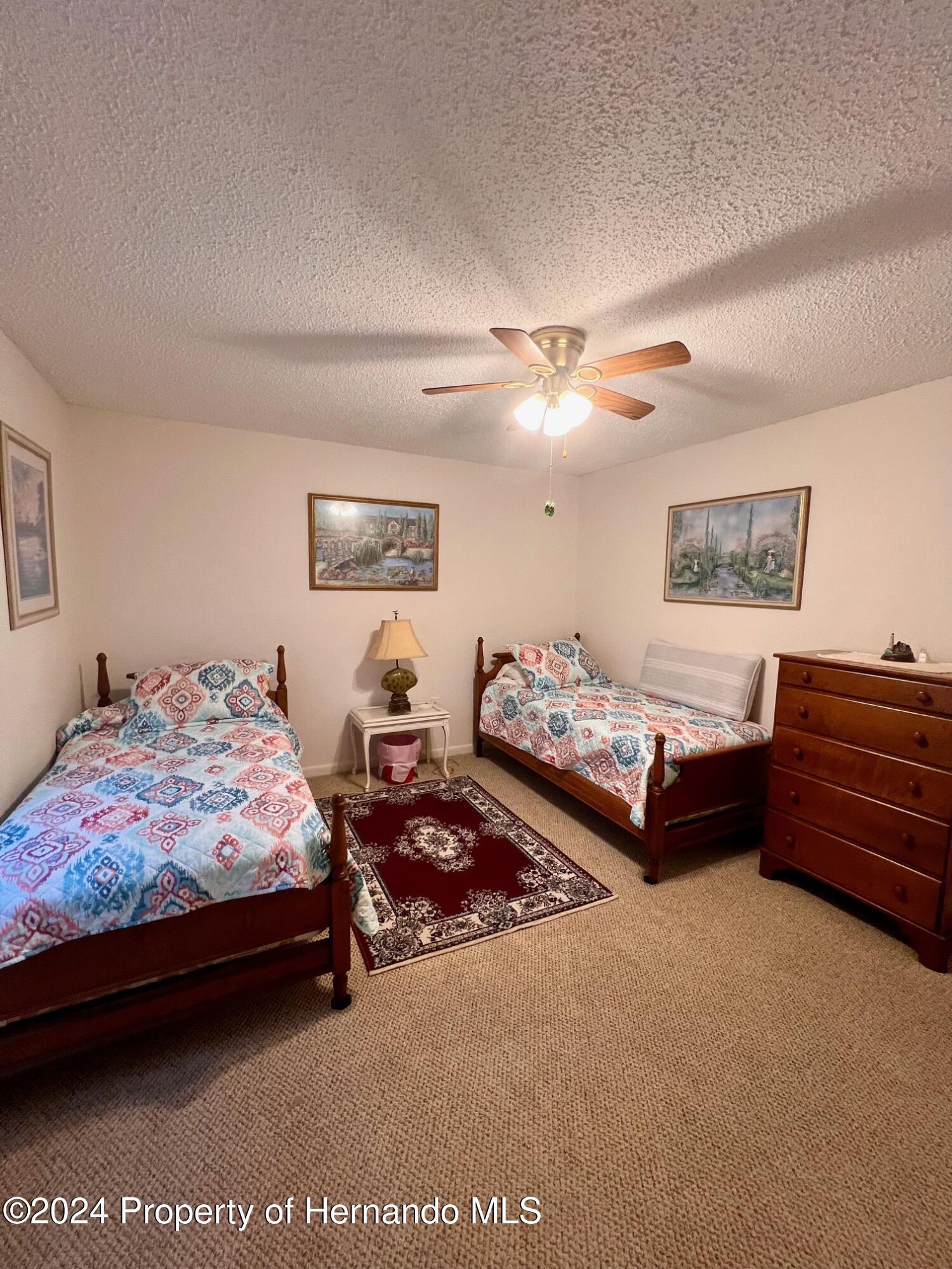 4660 Marine Parkway New Port Richey, FL 34652 - Photo 18 of 18 a bedroom with bed window and couch