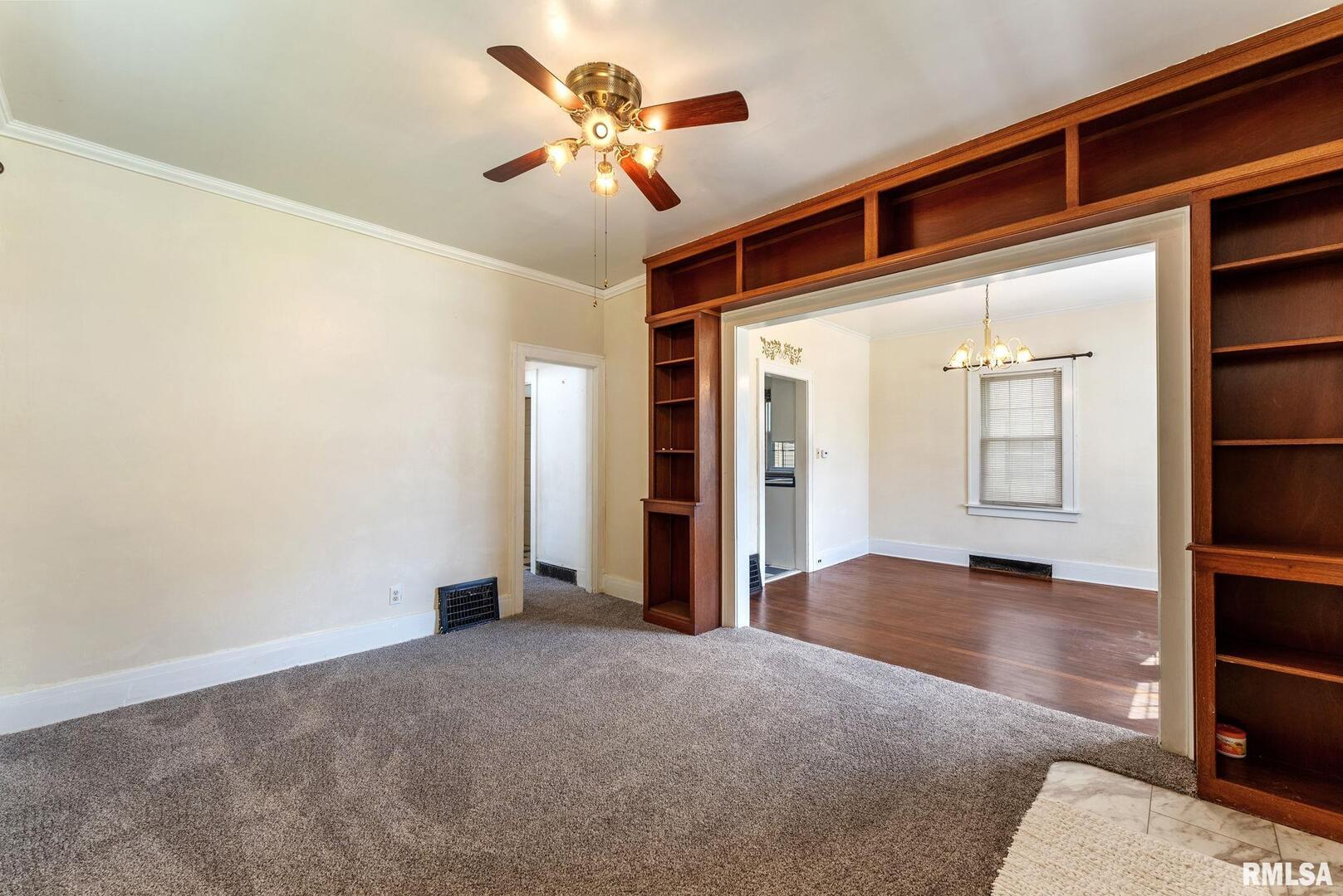 1904 30th Street Moline, IL 61265 - Photo 5 of 13 an empty room with closet and windows