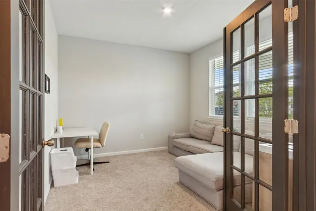 a utility room with wooden floor washer and shoe rack