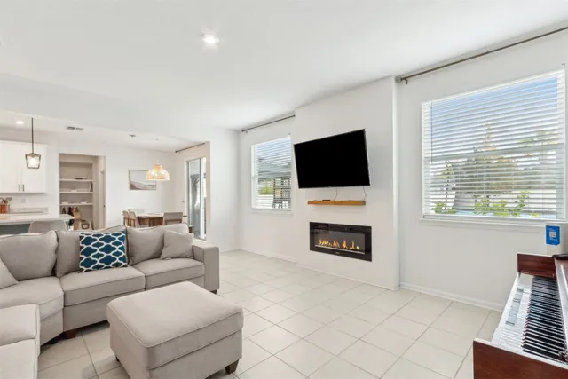 a view of a hallway with entryway and wooden floor