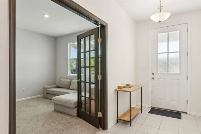 a view of a dining room with furniture and window