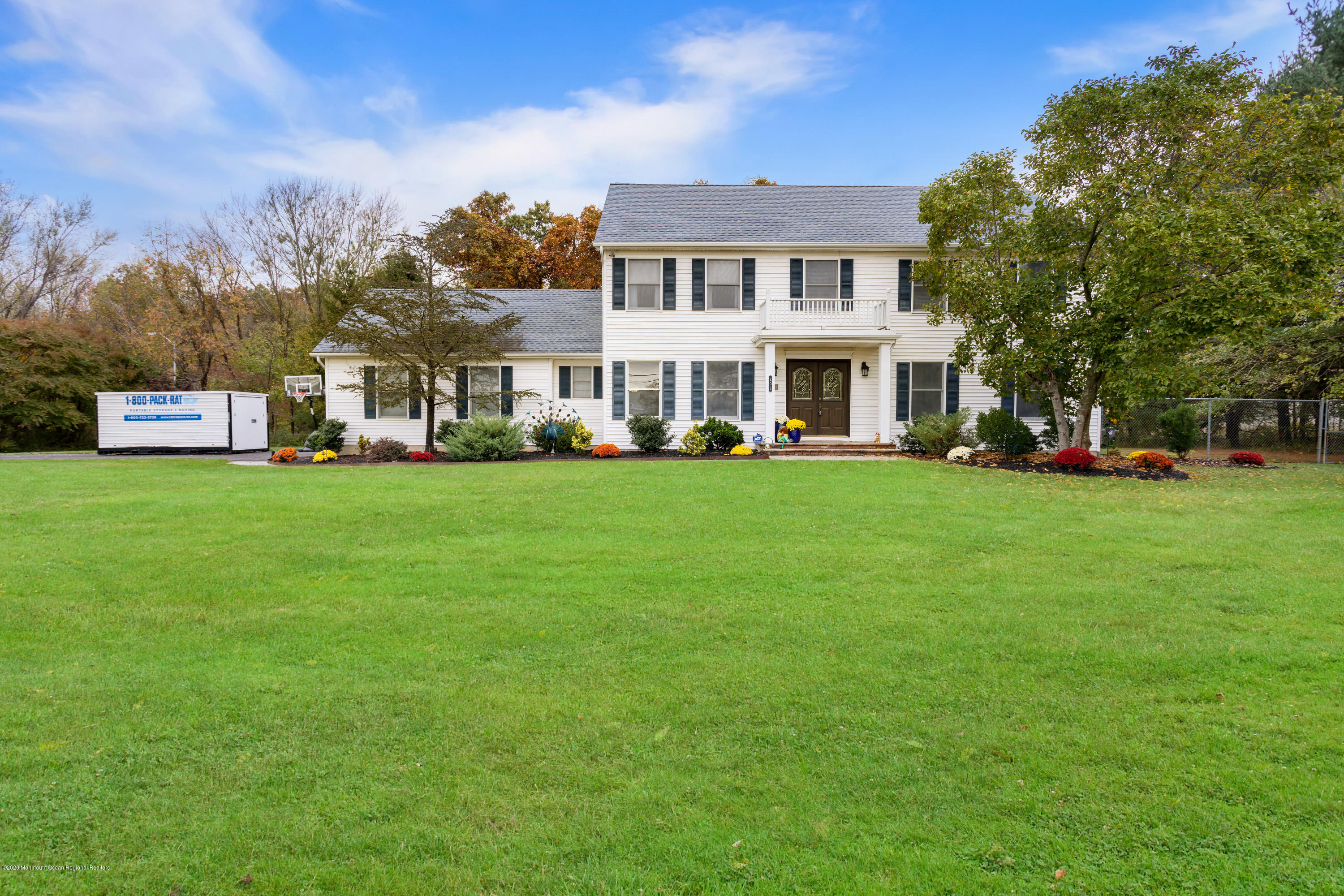 202 Adelphia Road Farmingdale, NJ 07727 - Photo 1 of 40 a view of a house with a big yard and large trees