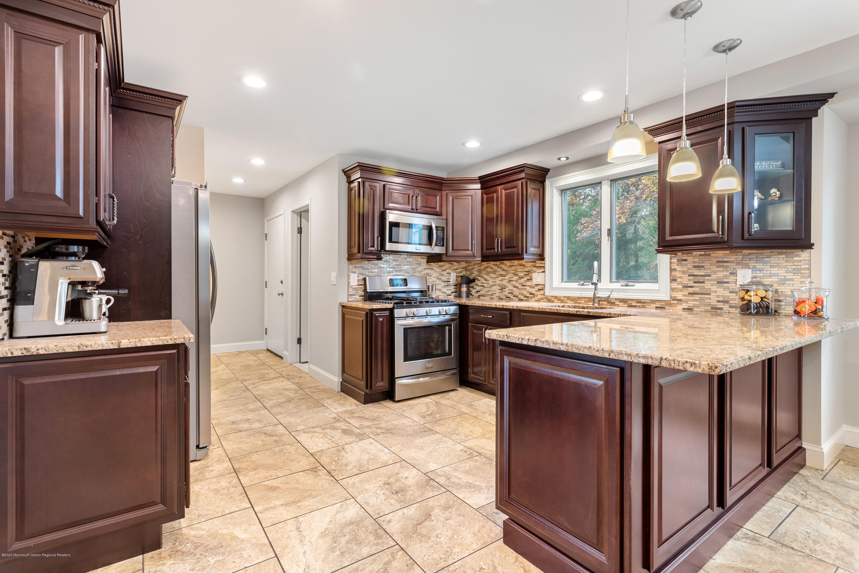 202 Adelphia Road Farmingdale, NJ 07727 - Photo 13 of 40 a kitchen with stainless steel appliances granite countertop a sink and cabinets