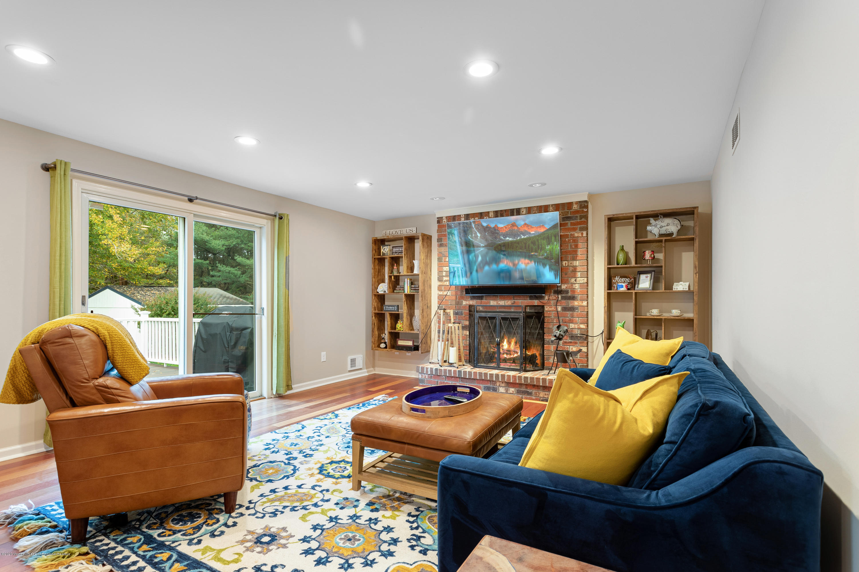 202 Adelphia Road Farmingdale, NJ 07727 - Photo 17 of 40 a living room with furniture fireplace and a large window