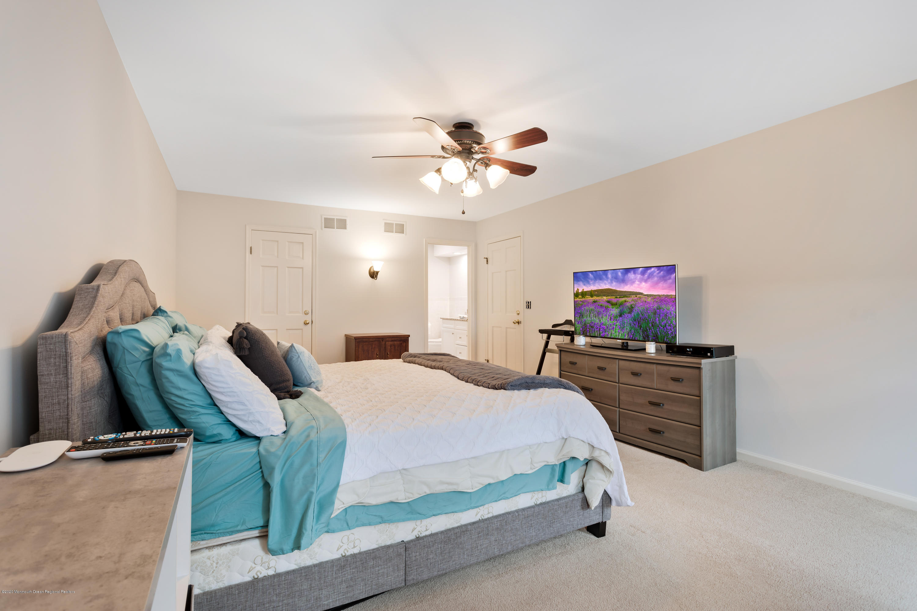 202 Adelphia Road Farmingdale, NJ 07727 - Photo 21 of 40 a bedroom with furniture and a flat screen tv