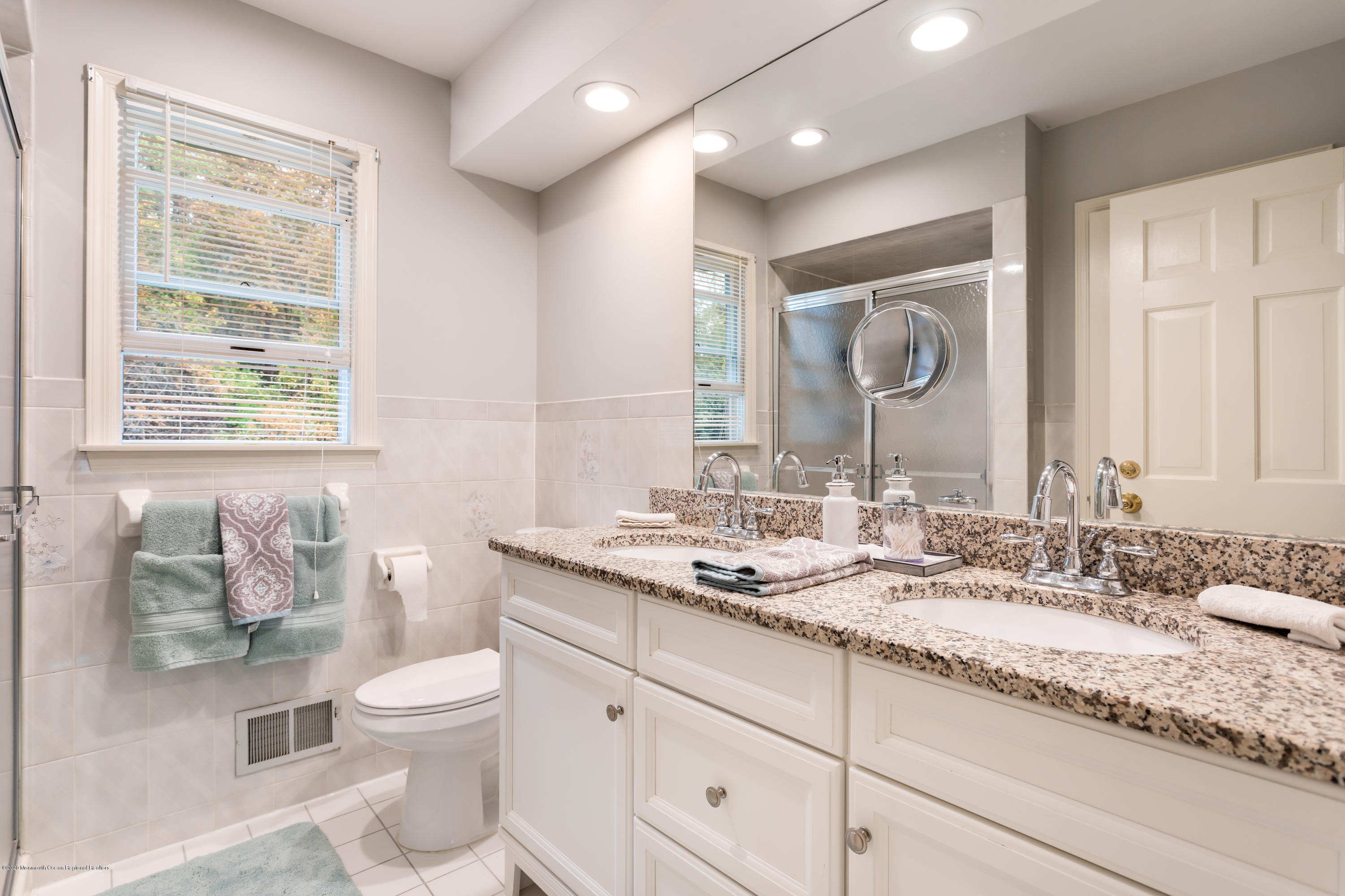 202 Adelphia Road Farmingdale, NJ 07727 - Photo 22 of 40 a bathroom with a granite countertop sink mirror and a toilet