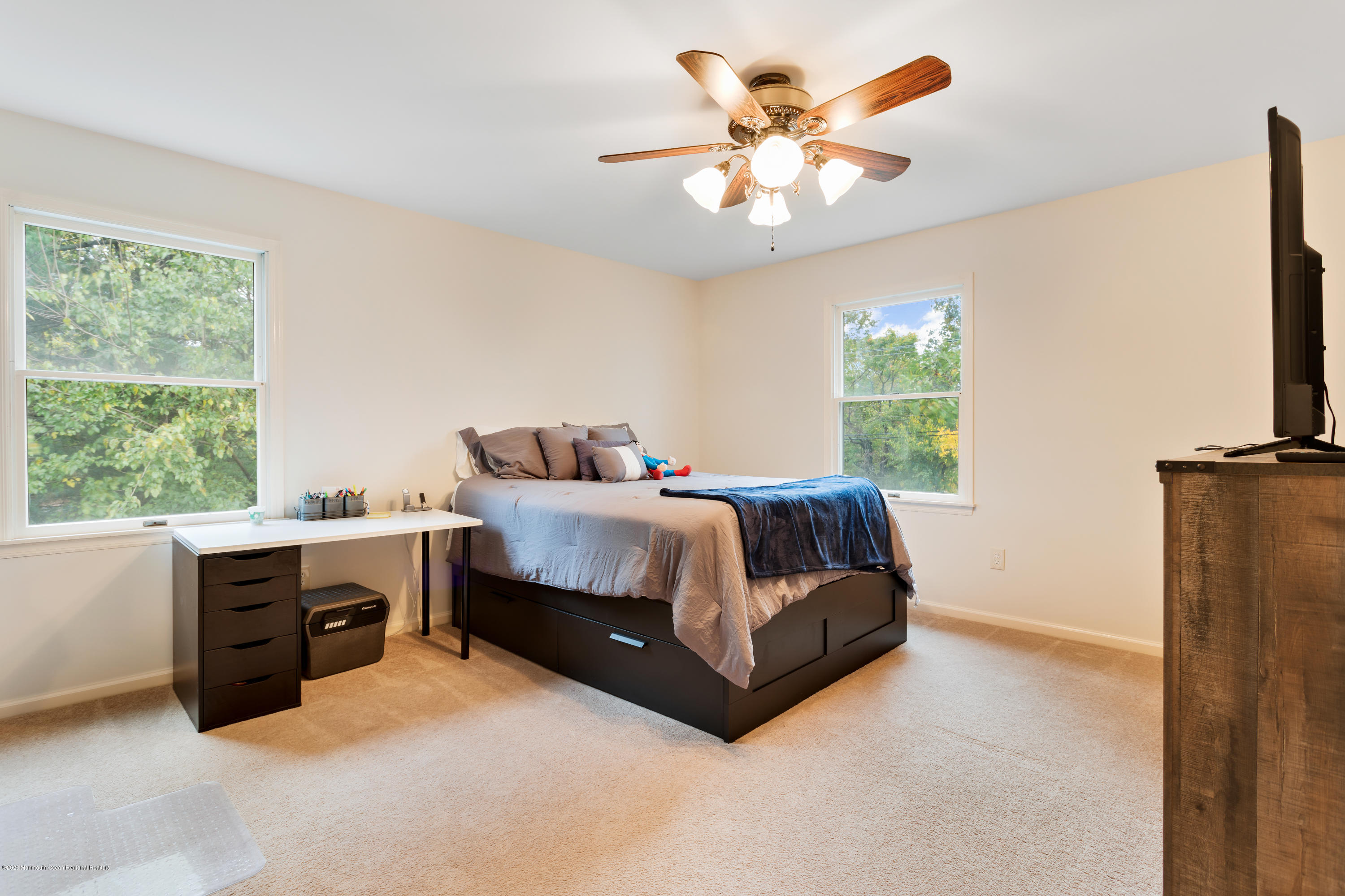 202 Adelphia Road Farmingdale, NJ 07727 - Photo 27 of 40 a bedroom with a bed and a flat screen tv