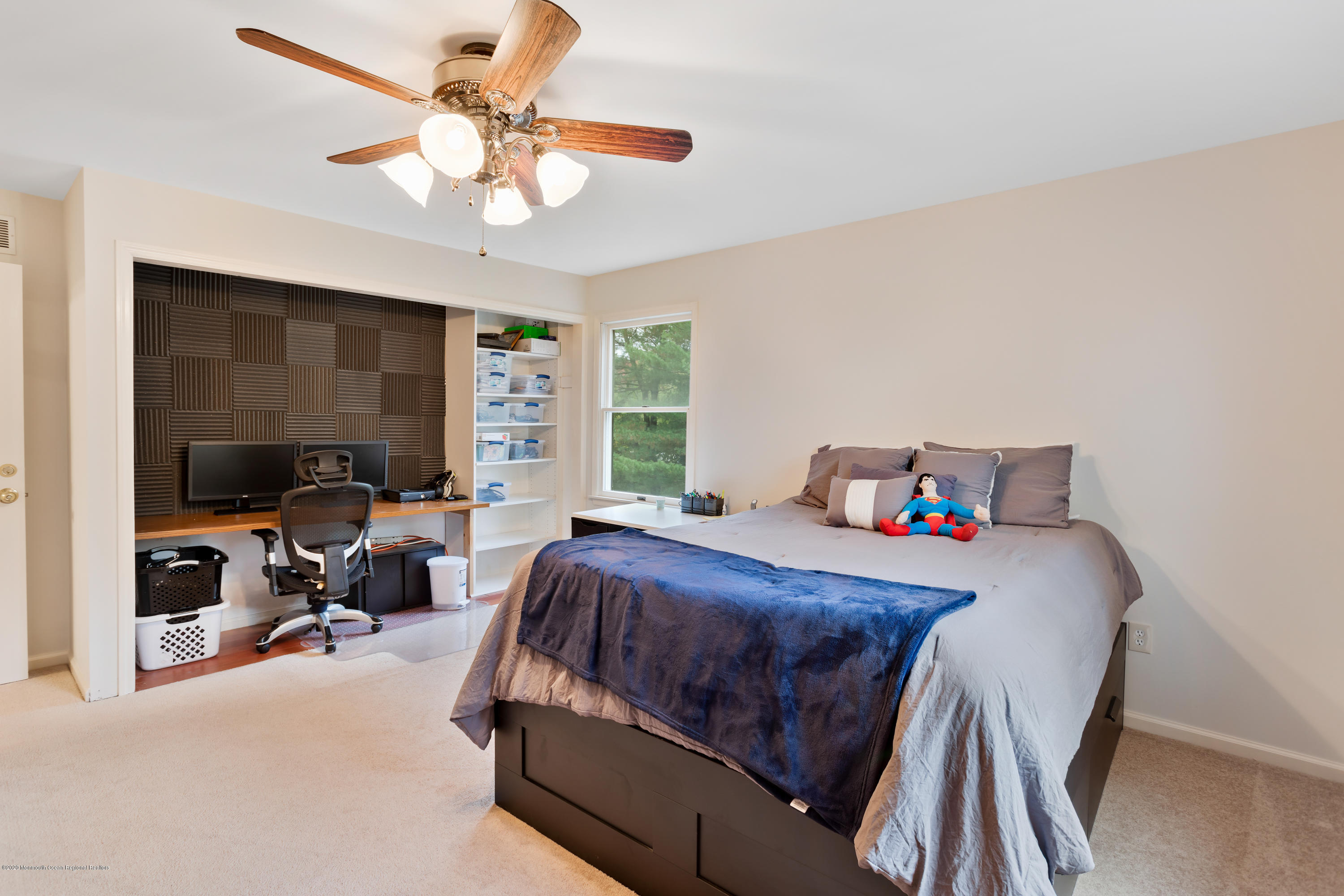 202 Adelphia Road Farmingdale, NJ 07727 - Photo 28 of 40 a bedroom with a bed and a chandelier