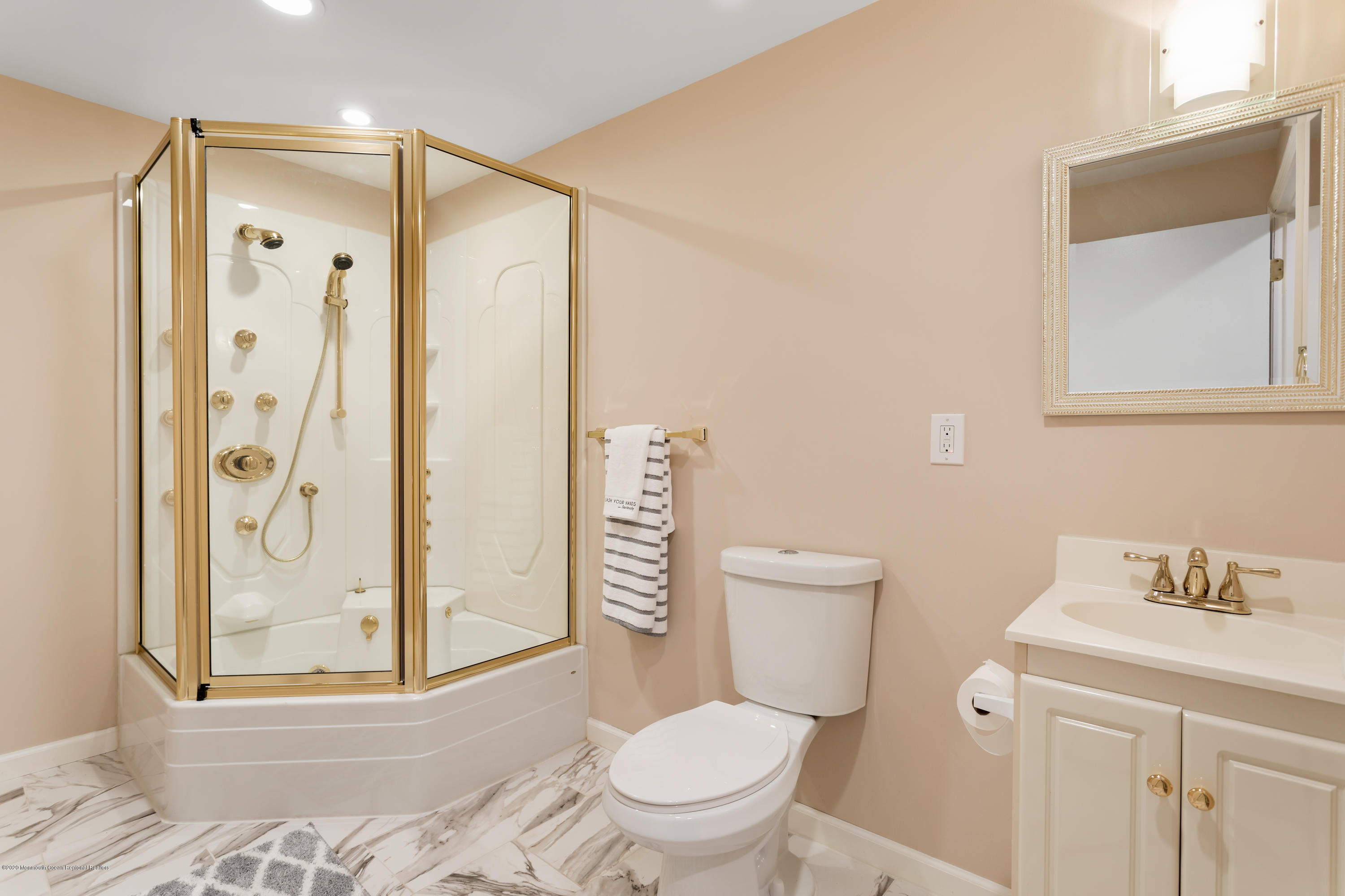 202 Adelphia Road Farmingdale, NJ 07727 - Photo 30 of 40 a bathroom with a toilet a sink and a shower