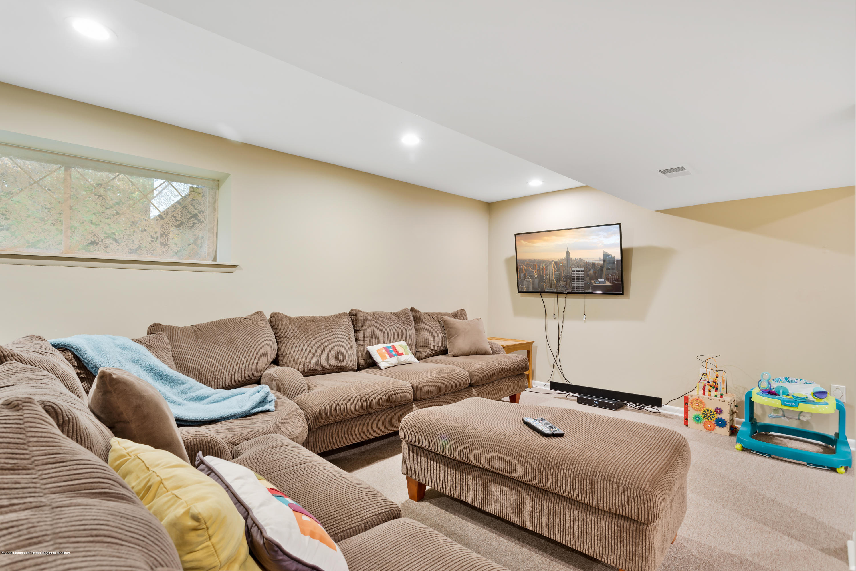 202 Adelphia Road Farmingdale, NJ 07727 - Photo 34 of 40 a living room with furniture and a flat screen tv