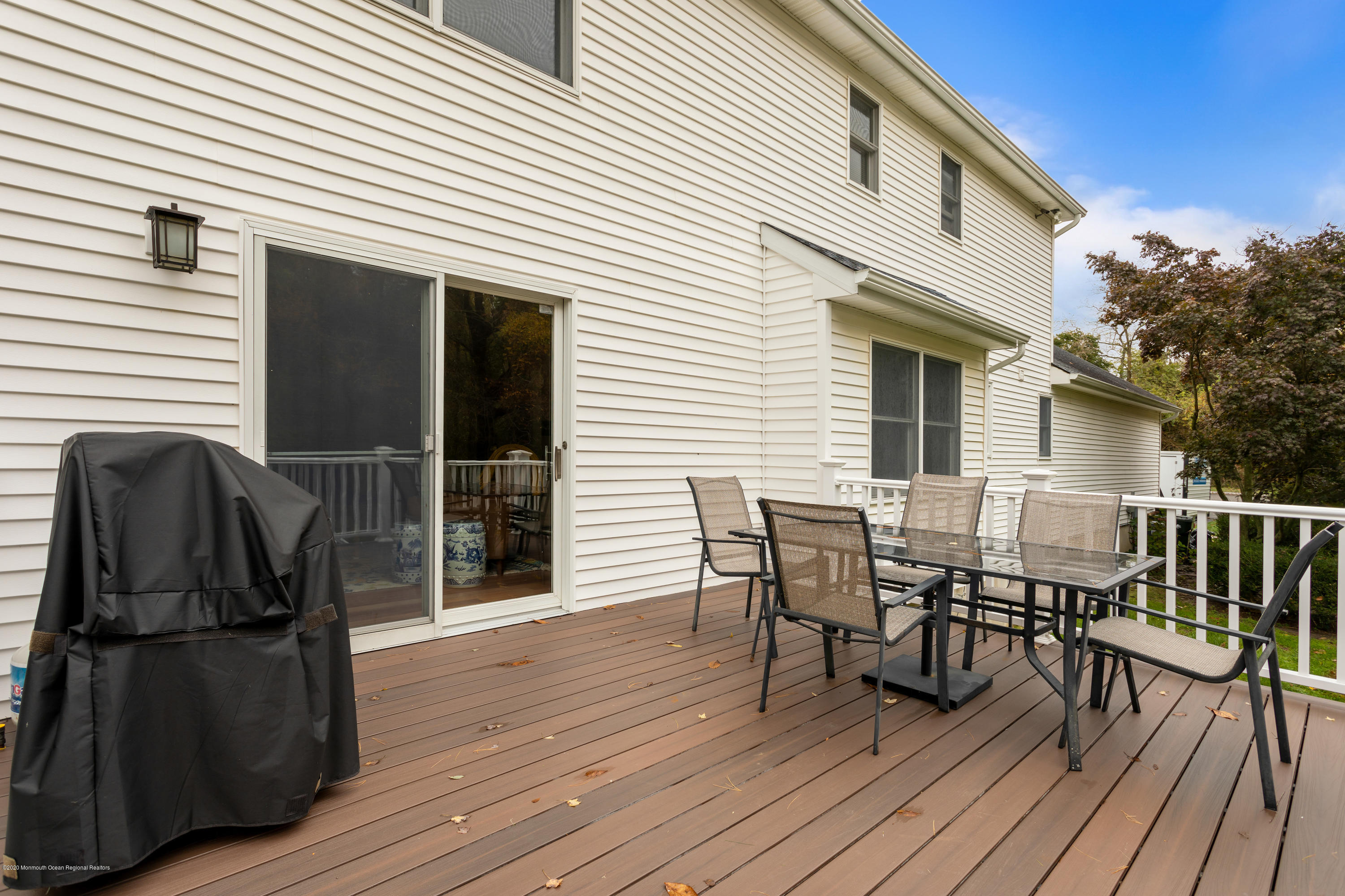 202 Adelphia Road Farmingdale, NJ 07727 - Photo 39 of 40 a view of a house with a deck and furniture