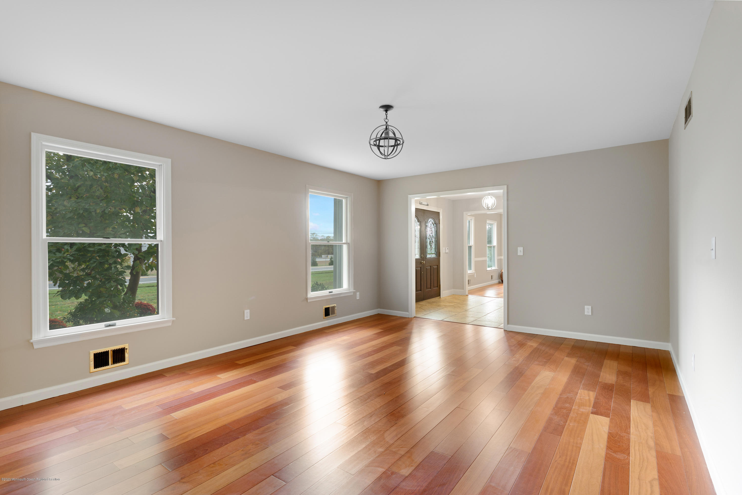 202 Adelphia Road Farmingdale, NJ 07727 - Photo 8 of 40 a view of an empty room with wooden floor and a window