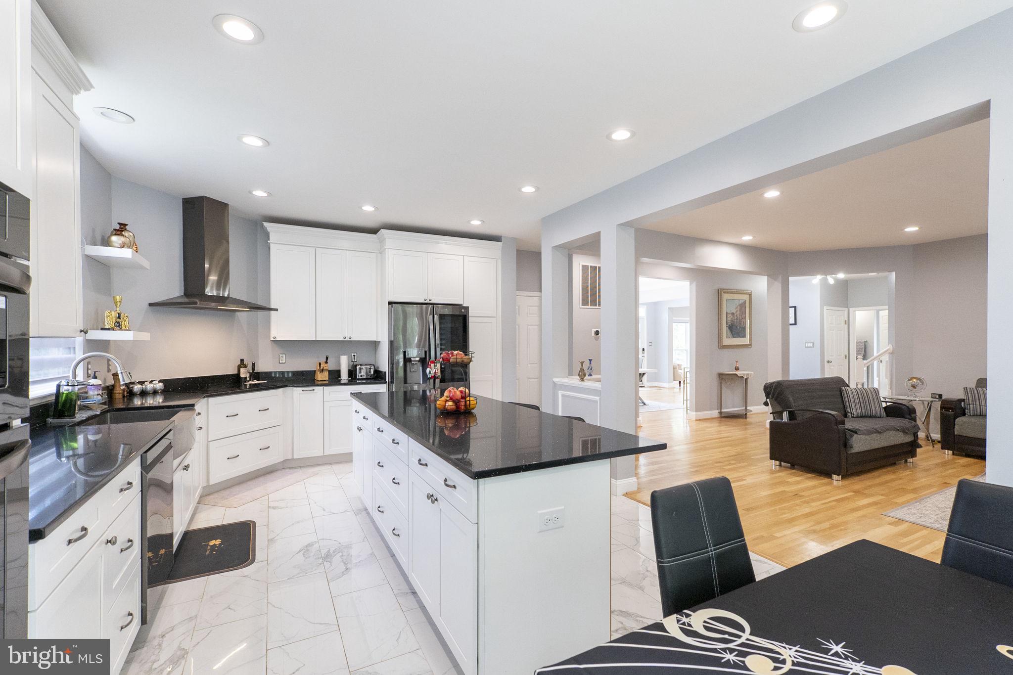6455 Saddlebrook Lane Frederick, MD 21701 - Photo 13 of 38 a large kitchen with stainless steel appliances lots of counter top space
