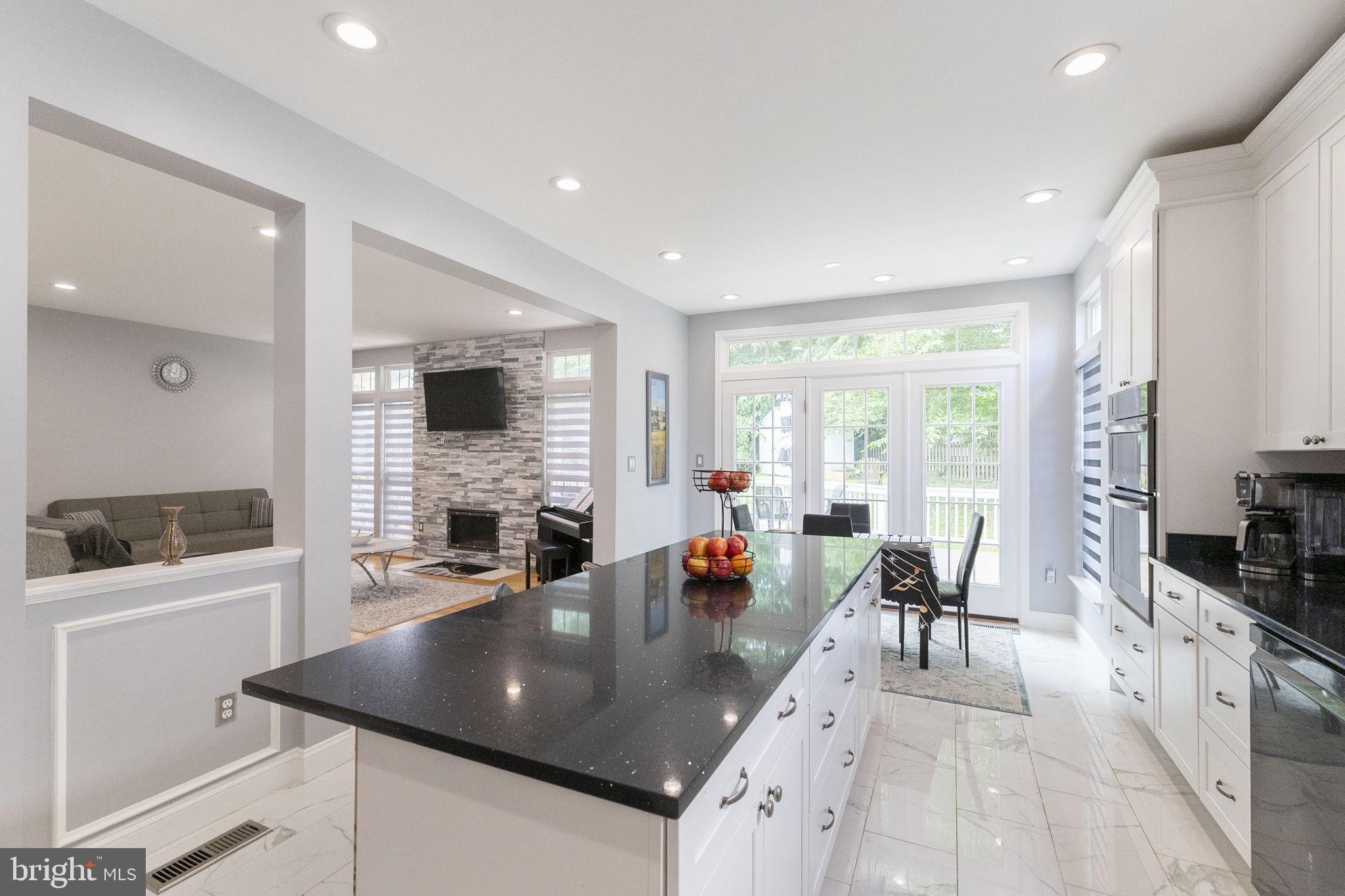 6455 Saddlebrook Lane Frederick, MD 21701 - Photo 16 of 38 a living room with fireplace furniture and a large window