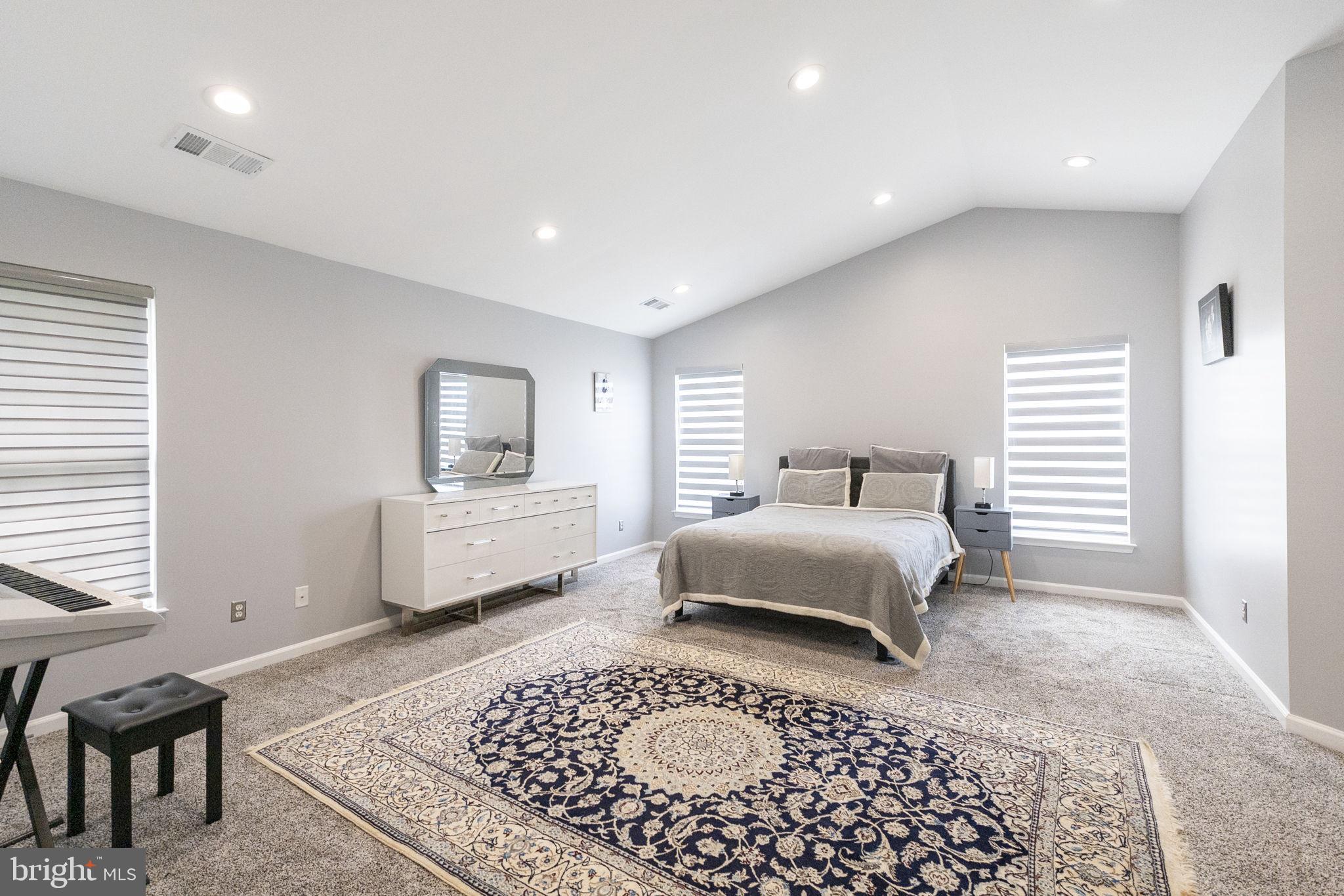 6455 Saddlebrook Lane Frederick, MD 21701 - Photo 20 of 38 a bedroom with a large bed rug and window
