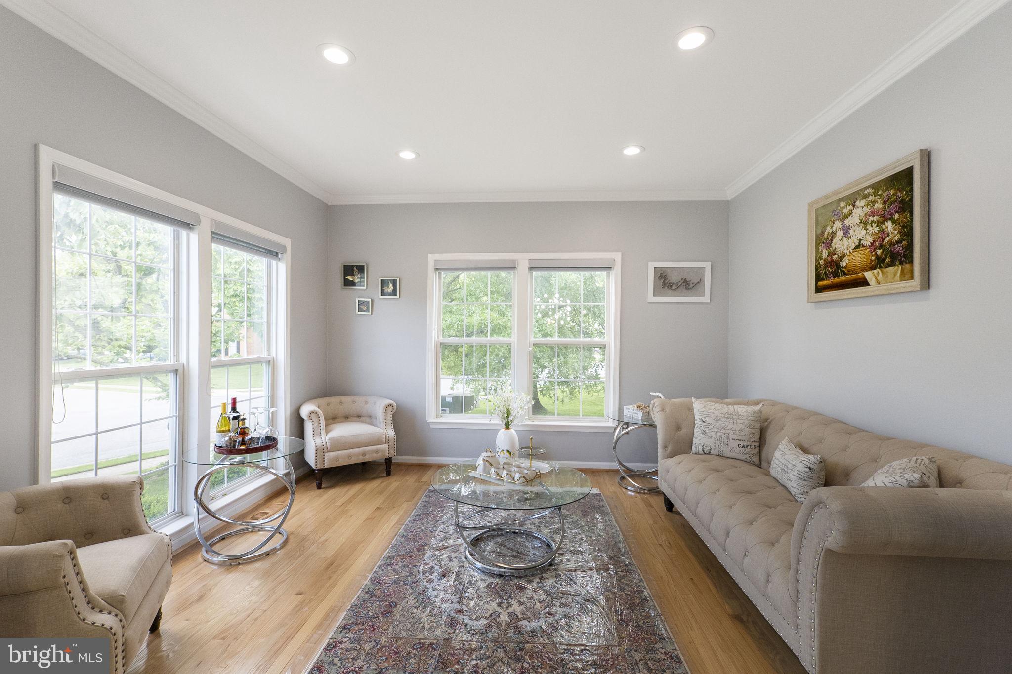 6455 Saddlebrook Lane Frederick, MD 21701 - Photo 3 of 38 a living room with furniture and a large window
