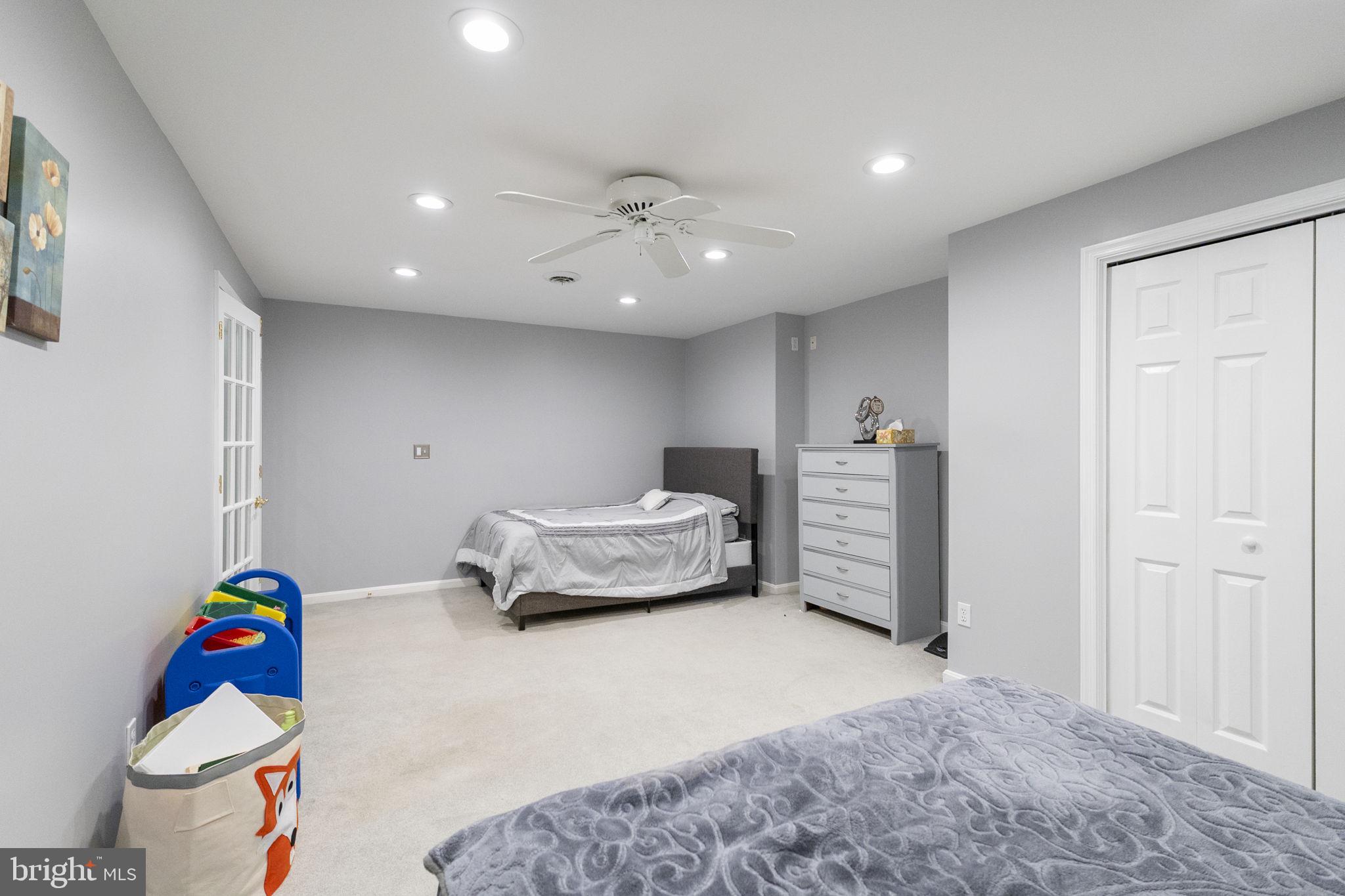 6455 Saddlebrook Lane Frederick, MD 21701 - Photo 32 of 38 a bedroom with a bed and a dresser in it