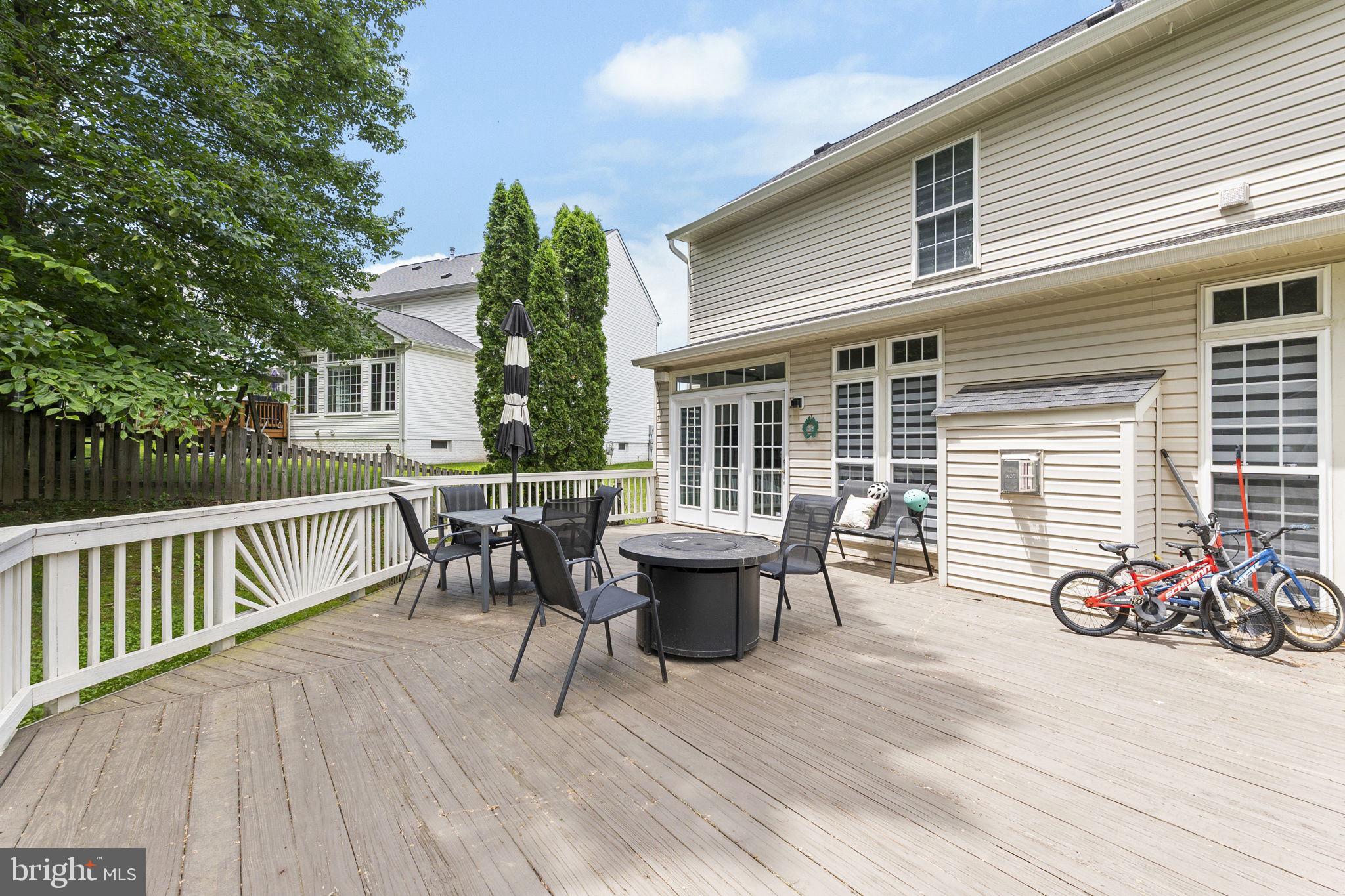 6455 Saddlebrook Lane Frederick, MD 21701 - Photo 34 of 38 a view of a patio with couches potted plants and wooden floor