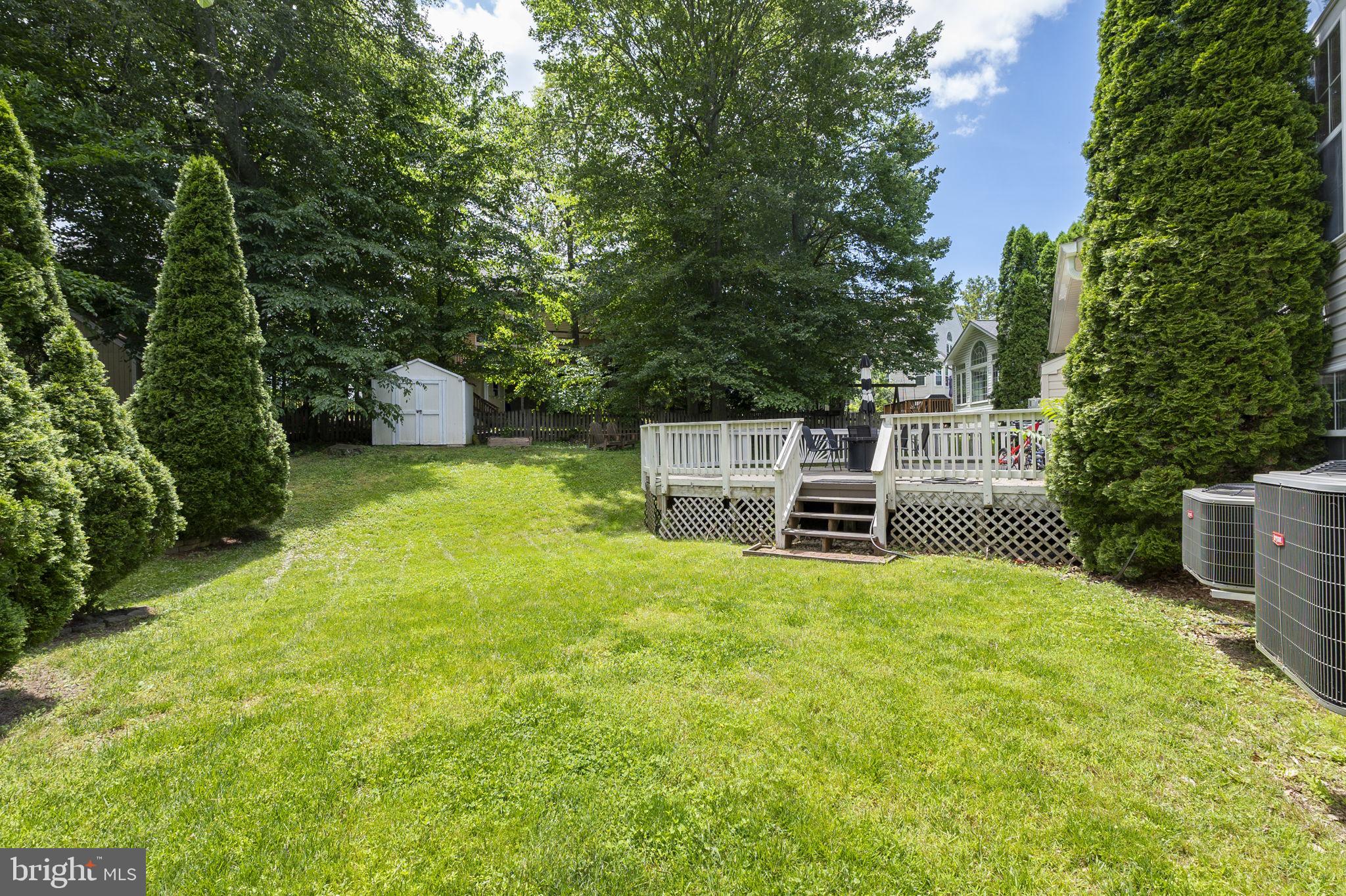 6455 Saddlebrook Lane Frederick, MD 21701 - Photo 35 of 38 a view of a chairs and table in the backyard