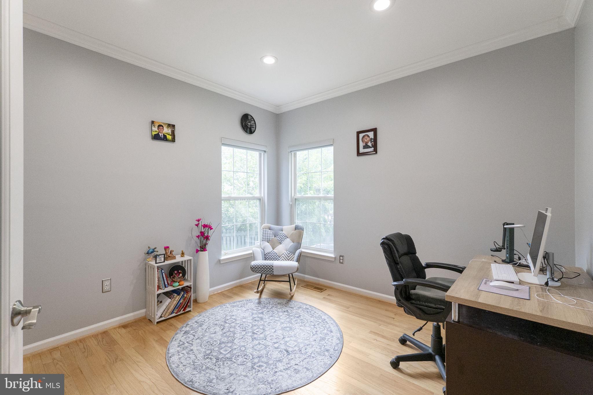 6455 Saddlebrook Lane Frederick, MD 21701 - Photo 6 of 38 a workspace with furniture and a wooden floor