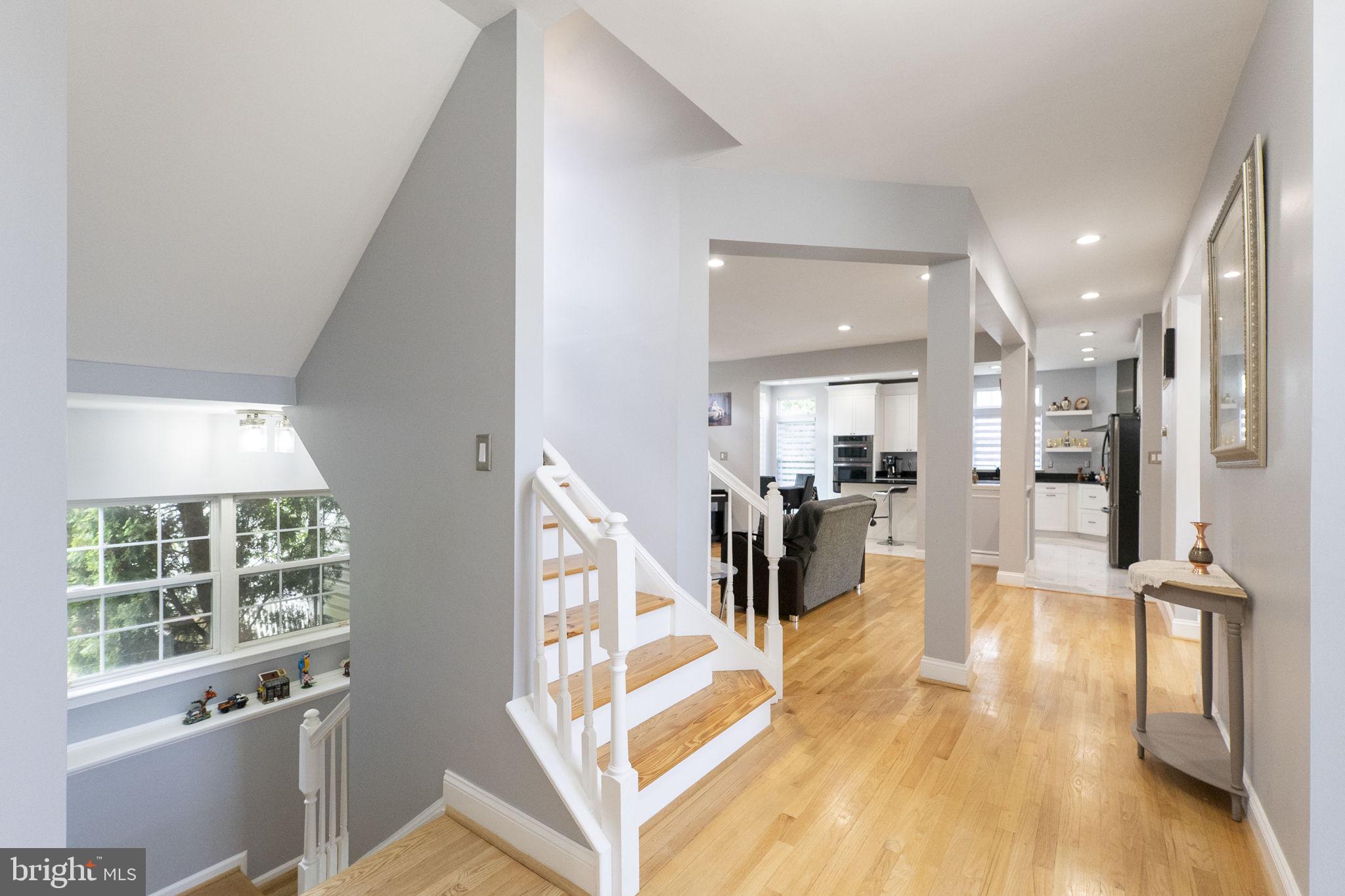 6455 Saddlebrook Lane Frederick, MD 21701 - Photo 8 of 38 a view of a living room with wooden floor and a large window