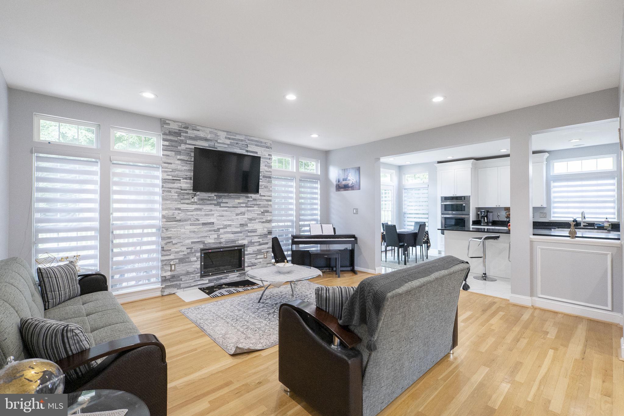 6455 Saddlebrook Lane Frederick, MD 21701 - Photo 9 of 38 a living room with furniture and a fireplace